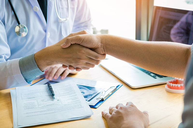 Dentist shaking hands