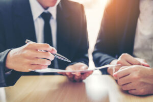 Business people Meeting negotiating a contract between two colleagues