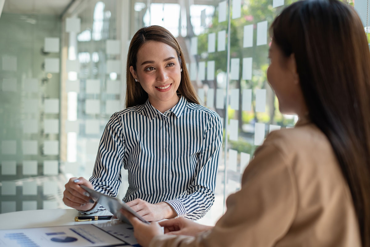 Two people having a discussion in an office setting