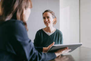 Woman meeting female banker for financial advice - stock photo