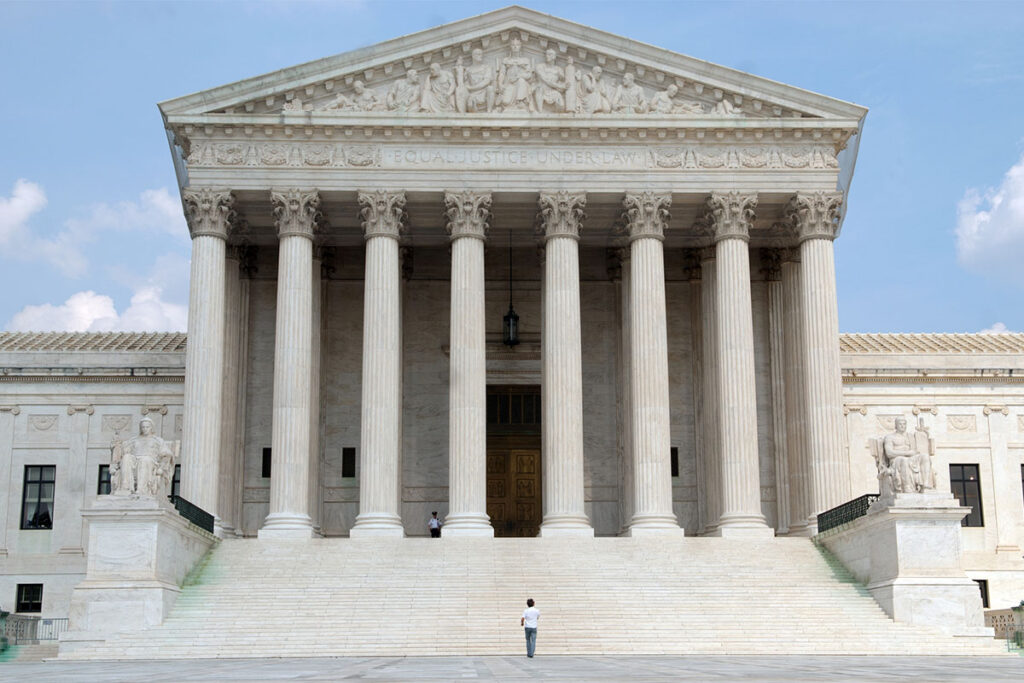 Young man approaching the steps to the Supreme Court in Washington, DC