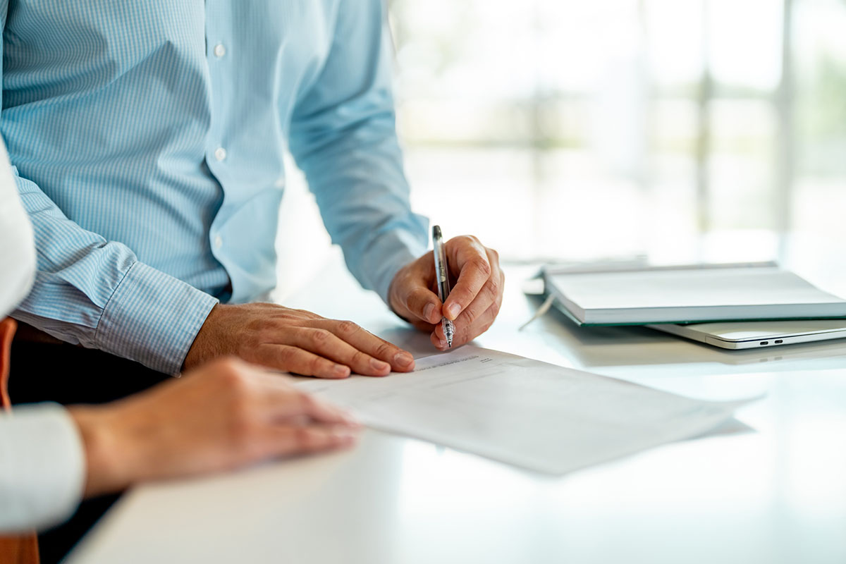 Business people negotiating a contract - stock photo