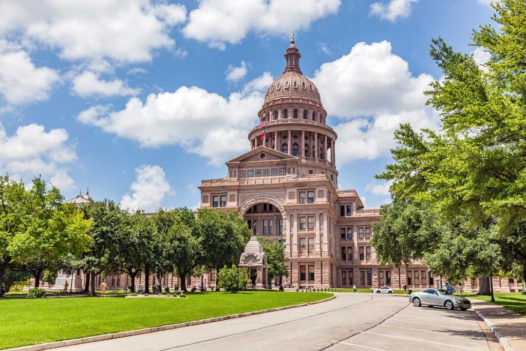 Texas State Capitol building in Austin, Texas, the USA. Blue cloudy sky.