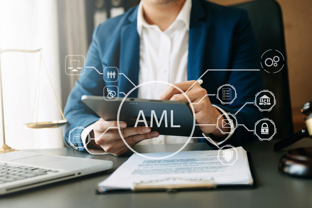 AML Anti Money Laundering Financial Bank Business Concept. judge in a courtroom using laptop and tablet with AML anti money laundering icon on virtual screen. - stock photo