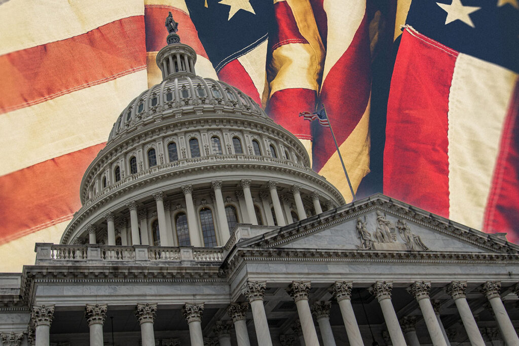 Government building against a background of US flags