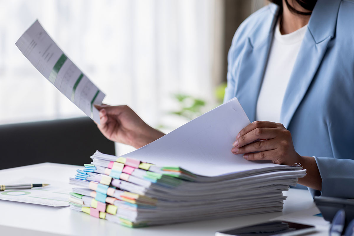 Business documents businessman check legal document review Prepare documents or analysis reports, tax items, accounting documents, data contracts, office partner agreements. - stock photo