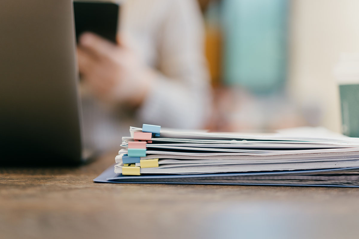 Close-up file papers in women office - stock photo