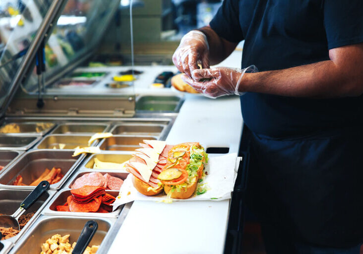 Sandwich being prepared at a restaurant