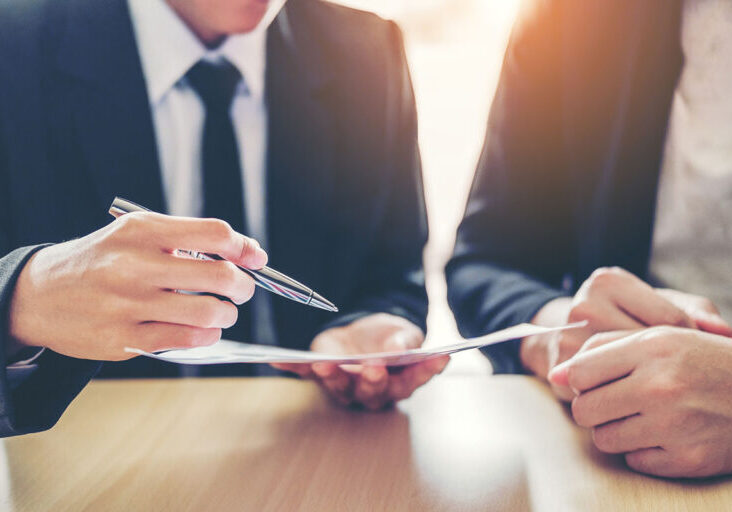 Business people Meeting negotiating a contract between two colleagues