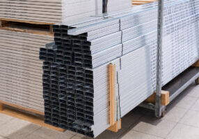 Stack of Building Material Aluminum Profile For Drywall At The Construction Work Site